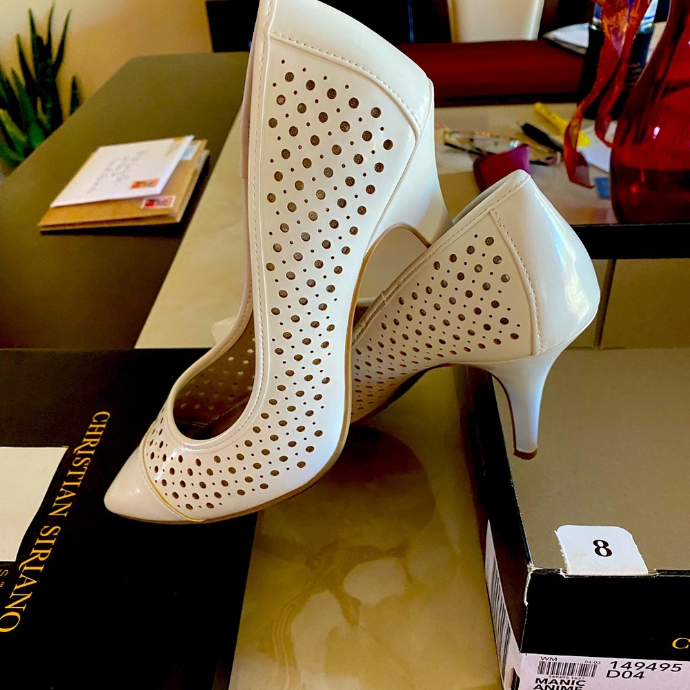 Woman’s white heels